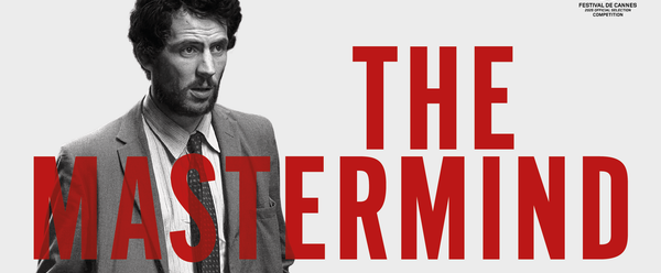 Man in a suit walking.