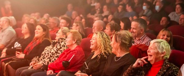 Audience sat in auditorium.