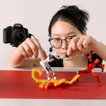 Girl moves figures with her hands