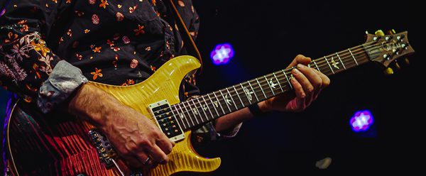Man playing a guitar.