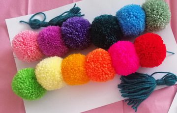Multi-coloured pom poms.