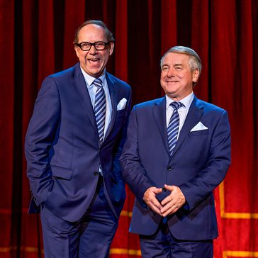 Two men in suits.