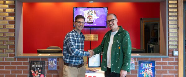 Councillor Stanley and Derek Bond shaking hands in front of Box Office.