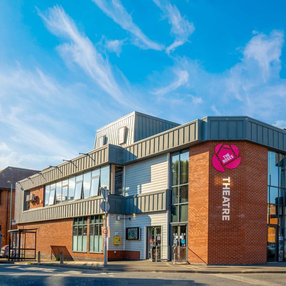 The Roses Theatre building on a sunny day.